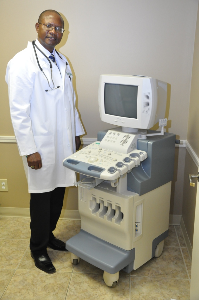 Dr. Ofoha with the ultrasound machine.